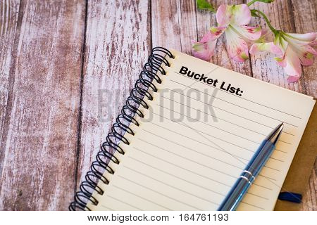 Bucket List motivational concept with notebook and calendar