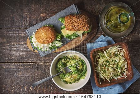 Different healthy snacks on the wooden table top view