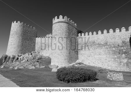 Avila (Castilla y Leon Spain): the famous medieval walls surrounding the city. Black and white