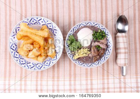 Red Brown Rice , Porridge With Mined Pork And Chicken Lever .