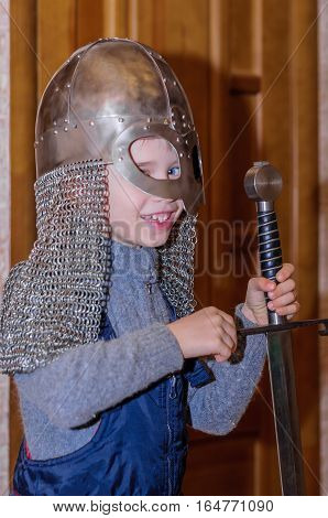 Kolomna Russia - January 03 2017: the child put the exhibits Blacksmith Settlement museum in interactive program by Andrey Kopylov aka linkpusher