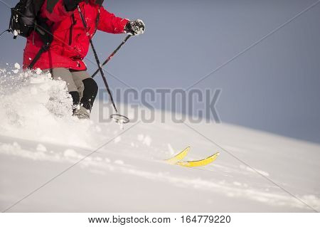 Fast skiing in deep snow. Winter time.