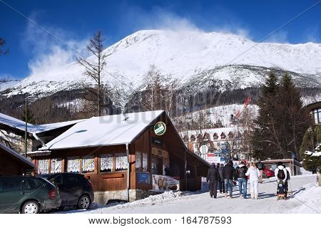 SLOVAKIA STARY SMOKOVEC - JANUARY 06 2015: View of the High Tatras mountains with the peaks covered with snow from center of Stary Smokovec. Is a popular resort in Slovakia for skiing and hiking.
