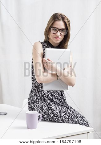 Portrait of a happy young executive in the office