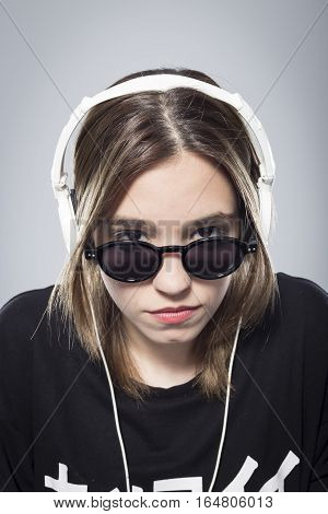 Happy girl listening to music with headphones