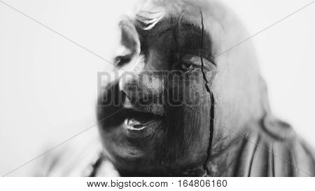 wooden statue laughing Buddha. The character of Chinese Buddhism