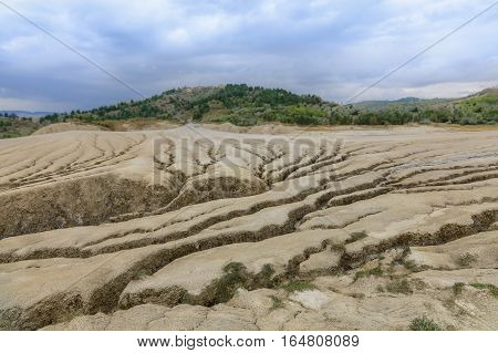 Earth Cracks, Formations Created By Natural Gas. Dry Land In Natural Park With Muddy Volcanoes, Dram