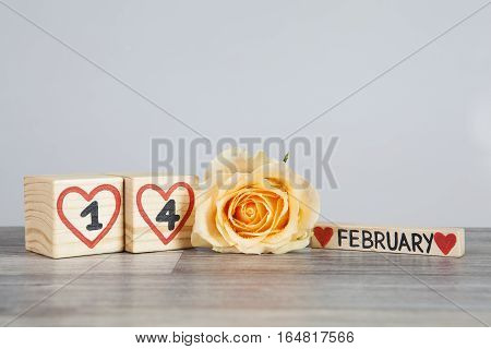 Handwritten February, one and four inside red hearts. Valentine s day composition. Bright background. Copy space.