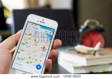 Bangkok, Thailand - December 9, 2016: A man using google map to travel in Hong Kong.