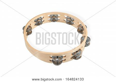 Wooden timbrel with metal plates lying horizontally isolated on white background