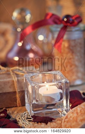 Composition of spa treatment. Natural handmade soap and sea salt with fragrant herbs. Spa concept.