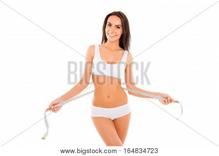 Pretty Smiling Woman In Lingerie With Tape Measure On White Background