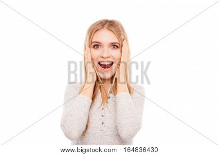 Portrait Of Happy Shocked Young Woman With Opened Mouth Touching Face