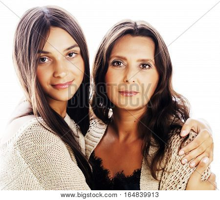 cute pretty teen daughter with mature mother hugging, fashion style brunette, lifestyle people concept close up