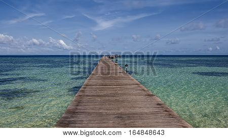 Pier on one of the Maldives, going to the ocean.