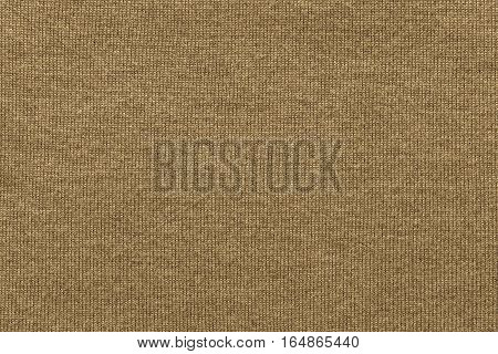 woven texture of woolen fabric or yarn closeup for a background or for wallpaper of sepia color