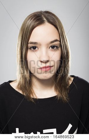 Expressive portrait of girl with neutral background