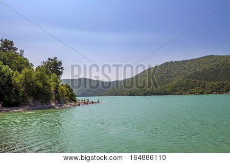 Scenin view of Abrau-Durso lake in Caucasus mountains.