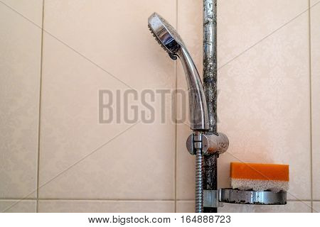 Hard water calcium deposit and corrosion on chrome shower tap