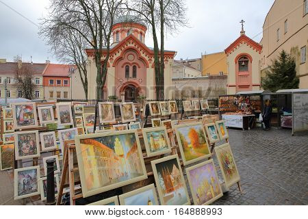 VILNIUS, LITHUANIA - DECEMBER 30, 2016: St Paraskeve Orthodox Church with paintings in the foreground