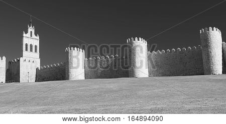 Avila (Castilla y Leon Spain): the famous medieval walls surrounding the city. Black and white