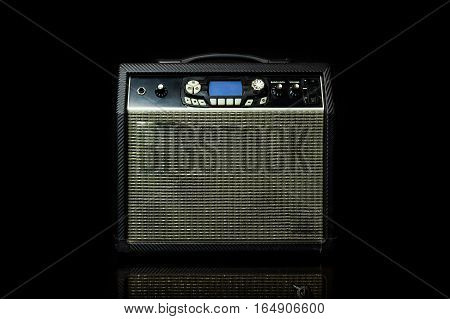 Guitar amp on a black background .