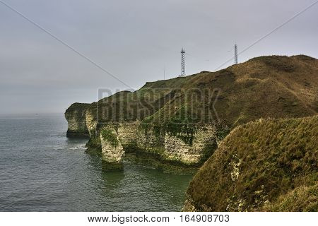A view of the beach and surrounding rock at the North Landing at Flamborough Head on the north Yorkshire coast.
