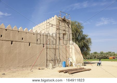 AL AIN UAE - NOV 29 2016: Restoration works on the historic Al Jahili fort in Al Ain. Emirate of Abu Dhabi United Arab Emirates