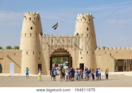 AL AIN UAE - NOV 29 2016: Tourist grop at the historic Al Jahlili fort in Al Ain. Emirate of Abu Dhabi United Arab Emirates