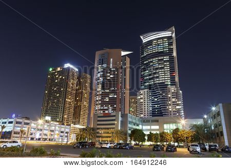 DUBAI UAE - NOV 29 2016: Skyscrapers at the Dubai Internet City illuminated at night. United Arab Emirates Middle East