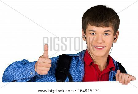 Teen male preppy with headphones giving thumbs up behind invisible sign