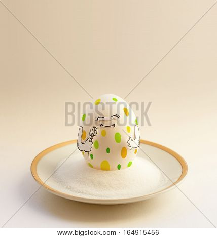 Nice egg on a saucer with hands smiling. Happy easter