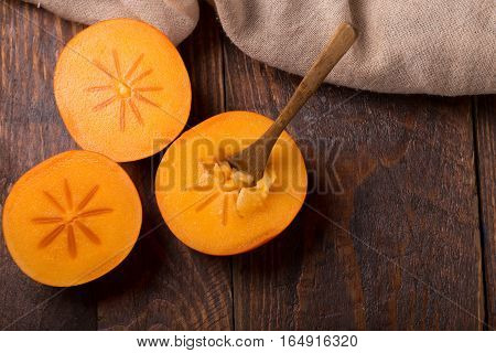 Diospyros Kaki On Rustic Wooden Background