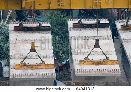 Delhi, India - 8th Jan 2017: Prefabricated concrete blocks used for the construction of the overhead delhi metro.