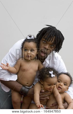 Stessed dad with his hands full isolated on white.