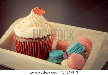 valentines heart on top of a chocolate cupcake.