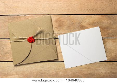 The envelope and a piece of text on a wood background