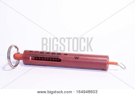 these is an old plastic(synthetics) spring balance