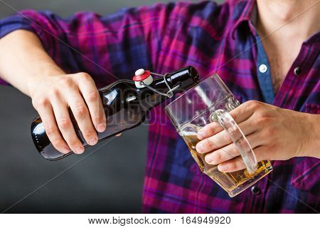 Tapster Fills Stein From Bottle.