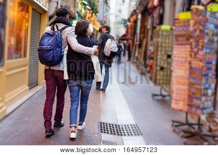 Multi-ethnic group of friends having fun in Paris, Latin Quarter, near Notre Dame Cathedral.