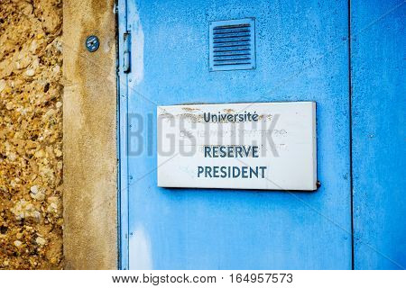 Universite Reserve President translating as Reserved for the Dean President as seen on the parking sign at the university campus parking
