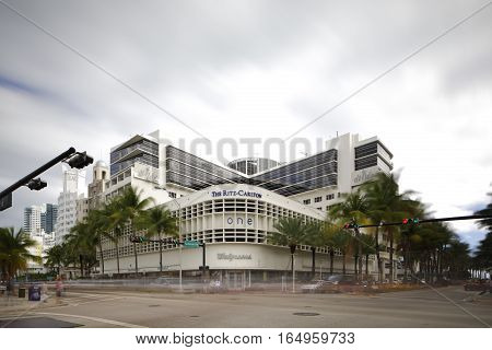 MIAMI BEACH - JANUARY 12: Stock image of the Ritz Carlton Hotel located at 1 Lincoln Road shot with a long 30 exposure to blur traffic and sky January 12, 2017 in Miami Beach FL, USA