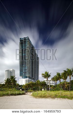 MIAMI BEACH - JANUARY 12: Stock photo of the Setai Hotel and residences located at 2001 Collins Avenue shot with a long 30 second exposure to blur sky and trees January 12, 2017 in Miami Beach FL, USa