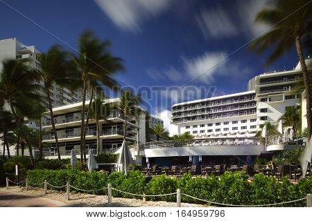 MIAMI BEACH - JANUARY 12: Stock image of the Ritz Carlton Hotel located at 1 Lincoln Road shot with a long 30 exposure to blur traffic and sky January 12, 2017 in Miami Beach FL, USA