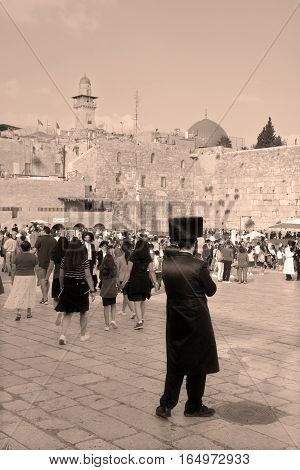 JERUSALEM ISRAEL 26 10 16: Jewish hasidic pray at the Western Wall, Wailing Wall the Place of Weeping is an ancient limestone wall in the Old City of Jerusalem. Second Jewish Temple by Herod the Great