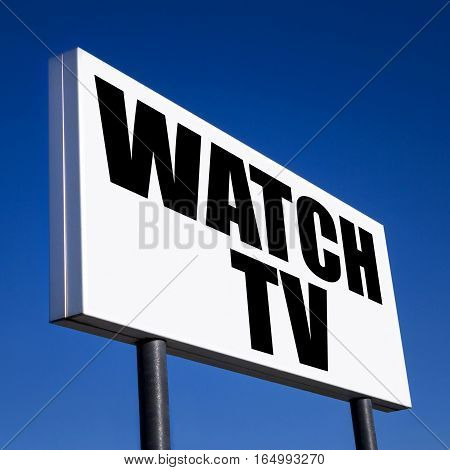 Horizontal billboard with the order to Watch TV against unreal blue sky. Abstract concept of consumerism human mind control power of corporations and lobbies.