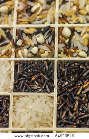 Variety of healthy grains and seeds in a wooden box mostly gluten free with rice, Sensitive Focus