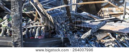 Damaged Industry Supermarket Metallic Facade After Arson Fire With Burnt Debris After Intense Burnin