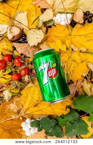 Saint-petersburg, Russia, 17102018 Drink 7up In A Glass Tin Bottle On Autumn Yellow Green Foliage Of