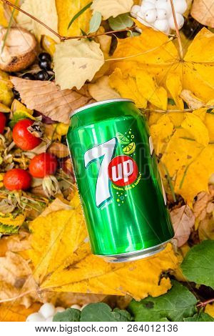 Saint-petersburg, Russia, 17102018 Drink 7up In A Glass Tin Bottle On Autumn Yellow Green Foliage Of